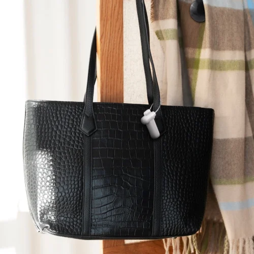bag-hanging-from-furniture-item-indoors_23-2151073521